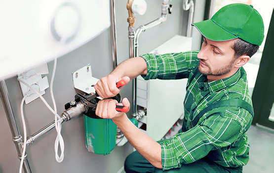 Plumber installing water softener system