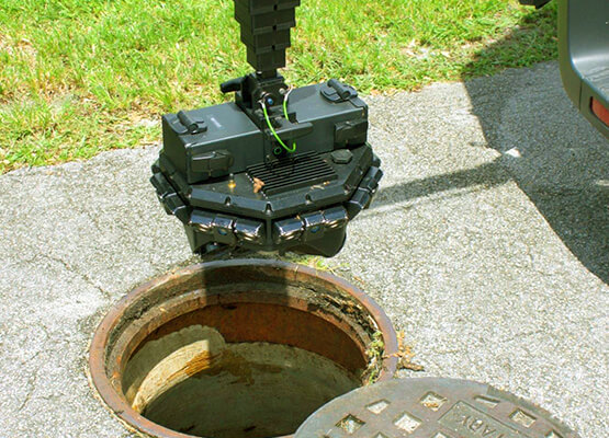 Plumber inserting sewer camera